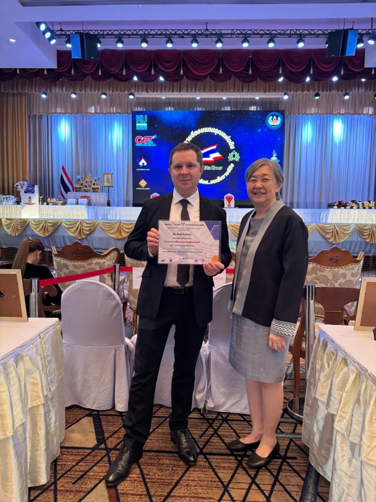 Rob Parker with St Andrews School Director Khru Noke at the award ceremony